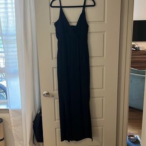Black jumpsuit with slits on the sides of the legs